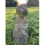 A reconstituted stone fountain, child on fish. 33cms h.