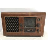 EKCO wooden cased radio receiver type A28. 64 w x 38cms h. Condition ReportVeneer chips to one side,