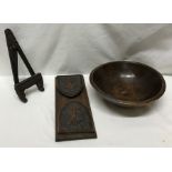A turned wooden bowl 27 w x 9cms h, an extending carved wooden bookstand 33cms closed and a small