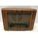 A PYE walnut cased radio. Type P75. 41cms w x 31cms h x 19cms d.Condition ReportSome varnish blemish