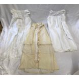 Baby's Christening cape made of yellow cotton and lace with two cotton Christening gowns.Condition