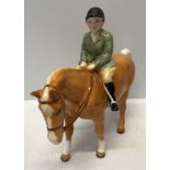 A Beswick Huntsboy on light brown pony. Approx. 14.5cms h x 16.5cms l.Condition ReportVery good