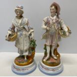 A pair of 19thC figures, a man and woman both with roses. 30cms h.Condition ReportLady with