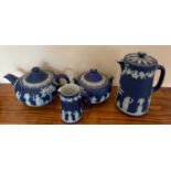 A Wedgwood Jasperware teapot, hot water jug and sucrier.Condition ReportSucrier with chip to body