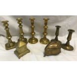 Brassware to include three pairs of candlesticks 22cms h and 17cms h, a brass box with finial top