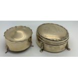 Two lidded hallmarked silver dressing table boxes. One Birmingham 1919 with K M inscribed to the