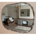 A mid C20th frameless wall mirror. 46cm h x 61cm w.Condition ReportSlight loss to mirror in places.