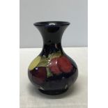A Moorcroft plum design vase 15.5cm with made in England and Moorcroft marked to base with