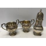 A hallmarked silver sifter A. Bros Ltd Birmingham 1946 and a silver sugar bowl and cream jug