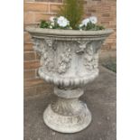 Two reconstituted stone garden urns. 60cms h x 53cms d.