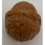 A Chinese Hediao carved walnut shell with leaves and figures, 4cm l.Condition Reportlight colour, no
