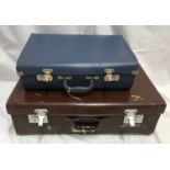 A brown leather suitcase with a bakelite handle 61cms w x 36cms d x 20cms h and a small blue