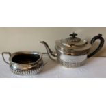A hallmarked silver teapot and sugar bowl. The teapot with ebony knop and handle, Sheffield 1898 and