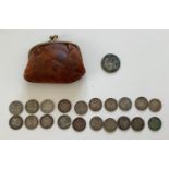 A small leather purse with cotton Pokka dot lining containing coins which include, 20 three pence