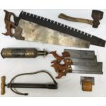 A collection of vintage tools to include two large wooden handled saws, largest with large tooth
