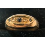 A 9ct gold ring set with 3 sapphires and 2 diamonds. Size N. 2.2gms.Condition ReportGood condition.