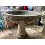 A large reconstituted stone bird bath on a pedestal base. 80cms x 64cms h.Condition ReportGood