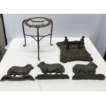 A collection of cast iron to include three sheep door stops 23.5cm l x 16.5cm w x 6cm, an ornate