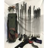 A selection of golf clubs of various makers to include Ping, Dunlop, Taylor Made, Forgan and