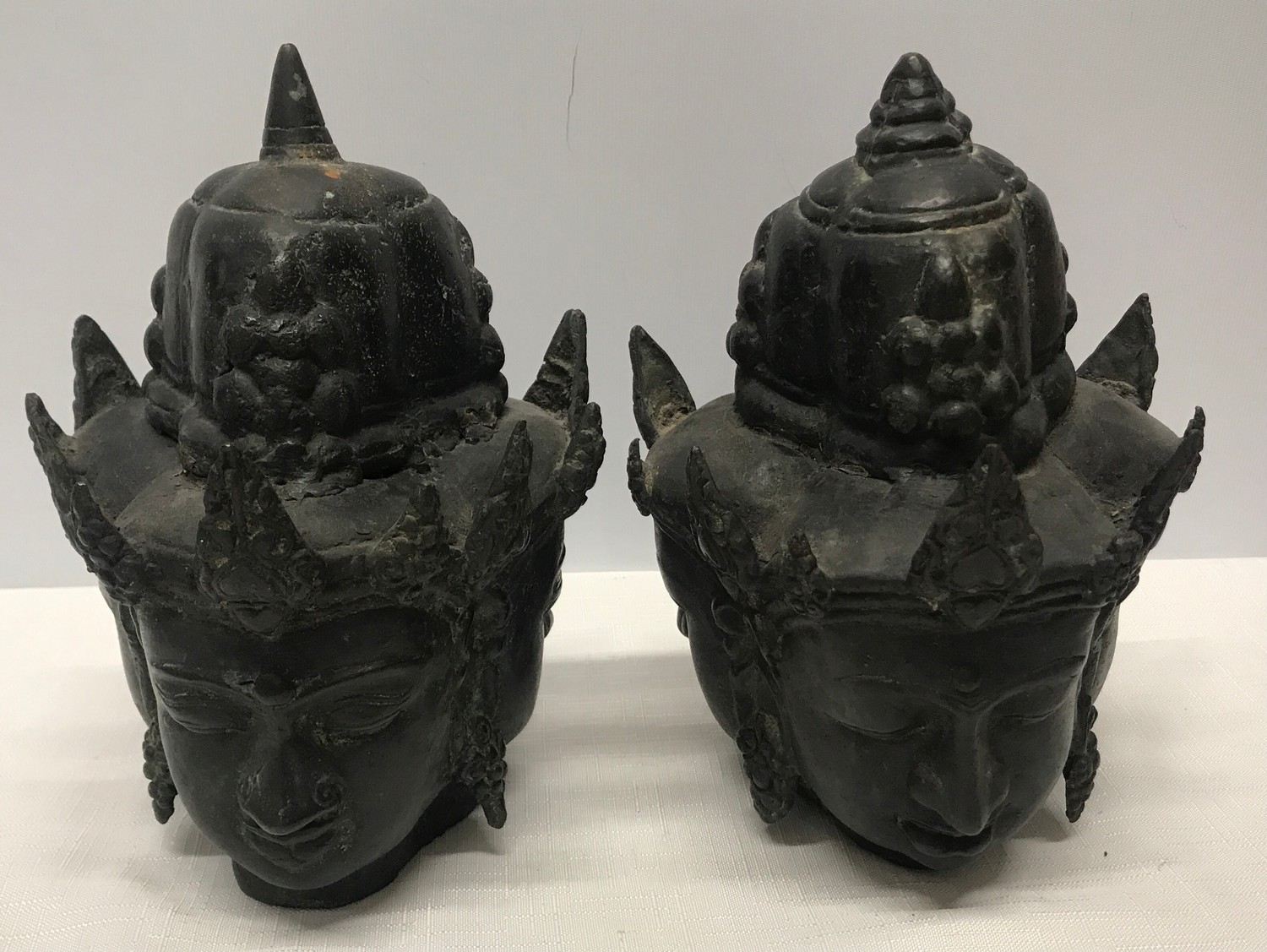 Pair of Tibetan bronze three headed busts 21cm h x 15cm w.Condition ReportMinor holes and