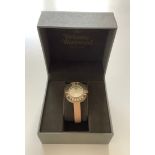 A Vivenne Westwood Time Machine ladies wrist watch with pale pink leather strap and gold details