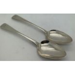 A pair of hallmarked silver dessert spoons London maker Samuel Godbehere , Edward Wigan and James