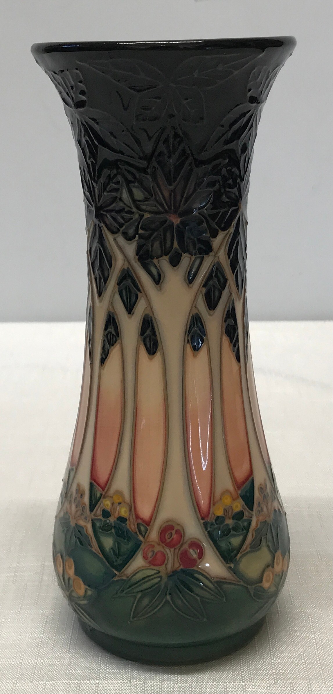 A Moorcroft Sally Tuffin-Cluny design slender baluster vase of tree/forest design c1990 21cm. Marked
