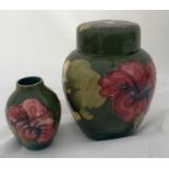 A Moorcroft ginger jar 16cm h , green ground and a small Moorcroft vase 9cm h.Condition ReportGinger