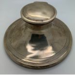 A hallmarked silver capstan inkwell with glass well. Base 12.5cms d Birmingham 1909. Weighted