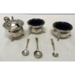 A hallmarked silver 3 piece condiment set with blue glass liners. F & S Birmingham 1939 with 3