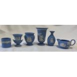 A collection of Wedgwood Jasper ware to include 4 x vases, a pot and a cream jug. Tallest vase