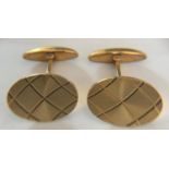 A pair of boxed 9ct gold cufflinks London 1977 with etched decoration. 8gms.Condition ReportGood