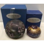 Two Jonathan Harris Studio Glass paperweights. One a trial piece silver and purple orchid design