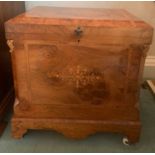 Walnut inlaid box with lift up lid and white ceramic castors. 51 w x 34 d x 55cms h.Condition