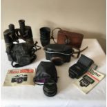 A collection of vintage cameras and a binocular to include an early Kodak Anastigmat Junior 620 1:8,