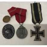 WWI and WWII German military medals including 1813-1914 cross with ribbon, 1941-1942 Russia campaign