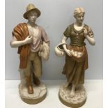 A pair of Royal Dux figurines in Harvest Time. Male with wheat and female with apples. Approx.