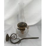 A Hinks & Sons glass wall mounted oil lamp with brass hanging mount. No shade. 19cm h 36cm from