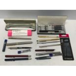 A collection of pens, spare ink and pencil leads including Parker, Sheaffer, Cross, others and a