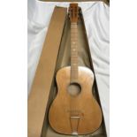 A 1960's/70's acoustic guitar possibly Hornby make with packaging box.Condition ReportGood