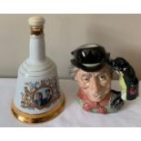 A Doulton Toby jug, The Walrus and Carpenter together with a Wade Bells Whisky commemorative