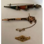 Two Scottish kilt pins, one silver and agate by Adie and Lovekin, lacking stones, the other yellow