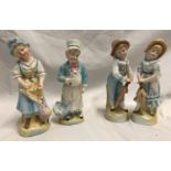 Two pairs of continental pottery figurines. Boy and Girl with brollies 18cms h and maid and cook