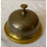 A heavy brass and bronze counter bell. 15.5cms d and approx. 10cms high.Condition ReportGood