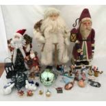 Christmas decorations to include a large wooden Santa 60cm, a Santa in a white coat 62cm, a small