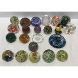 A collection of 22 unmarked glass paperweight, floral, bubble, multicoloured etc.Condition