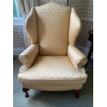 A pair of good quality winged armchairs on cabriole legs. Covered in gold coloured damask.