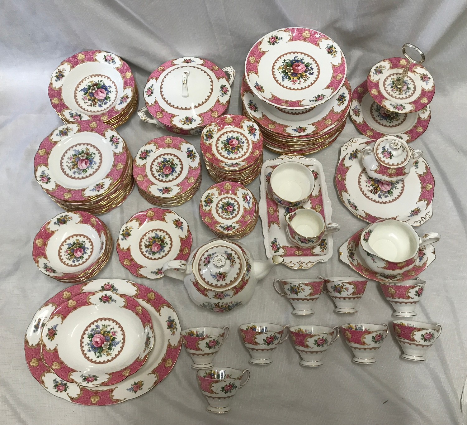 Royal Albert Lady Carlyle tea and dinner ware. Pink ground floral design with gilt border. 129