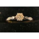 A 18ct gold and platinum diamond set ring in its original display box. Size K/L. 1.7gms.Condition