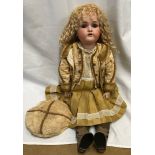 A Simon and Halbig pot headed doll with composite body, gold curly hair, open/close eyes and